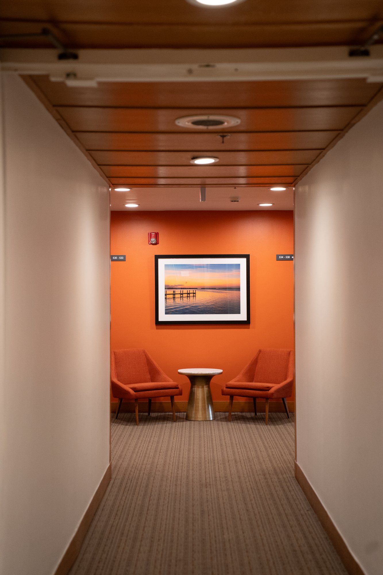 Hallway with curated artwork